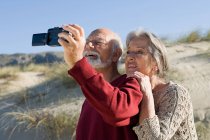 Senior couple taking a self portrait — Stock Photo