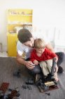Father and son building with blocks — Stock Photo