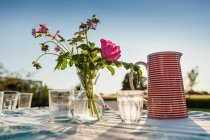 Sunlight on table of flowers — Stock Photo