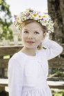 Portrait of young bridesmaid with floral headdress — Stock Photo
