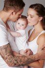 Mother and father with baby daughter — Stock Photo