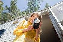 Young woman with video camera — Stock Photo