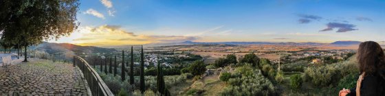 Panoramic of mature woman enjoying valley view, Bettona, Umbria, Italy — Stock Photo