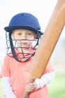 Boy with cricket bat outdoors — Stock Photo