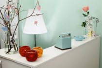 Interior of vintage shop with cash register and vases — Stock Photo