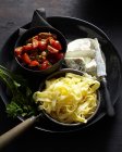 Tagliatelle with tomatoes and Caprino cheese on tray — Stock Photo