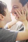 Boy showing affection to father, close-up — Stock Photo