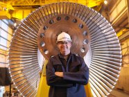 Engineer standing In Front Of Turbine — Stock Photo