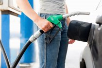 Cropped image of Young Woman at Gas Station — Stock Photo