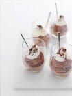Glasses of chocolate mousse desserts with spoons — Stock Photo