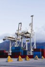 Containers and cranes in shipyard — Stock Photo
