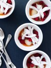 Cups of fruit salad with coconut slices — Stock Photo