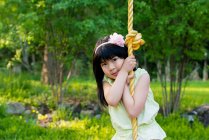 Girl on rope swing — Stock Photo