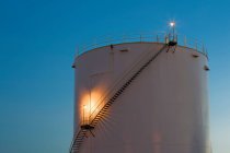 Gas storage tank at dusk — Stock Photo