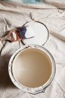 Open paint tin with white paint — Stock Photo