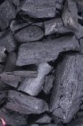 Charcoal pieces pile — Stock Photo
