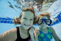 Girls in swimming pool — Stock Photo