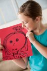 Girl with a drawing — Stock Photo