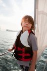 Young boy on board yacht — Stock Photo
