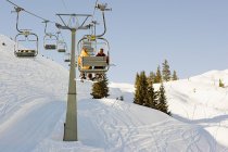 Two men on a ski lift — Stock Photo