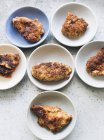 Top view of plates with fried chicken breasts — Stock Photo
