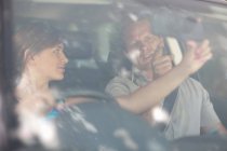 Father teaching teenage daughter driving — Stock Photo