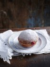 High angle view of icing donut on plate on table — Stock Photo