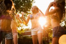 Girls dancing in garden — Stock Photo