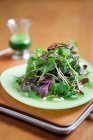 Fresh green salad served on table — Stock Photo