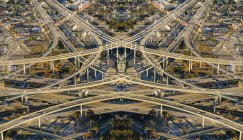 Abstract symmetrical aerial view of flyovers and highways — Stock Photo