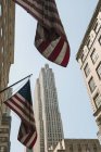 US flags and buildings, Manhattan, New York, USA — Stock Photo