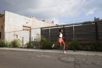 African american woman running in brooklyn, usa — Stock Photo