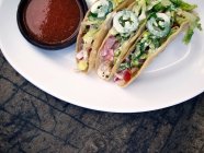 Tacos with salsa sauce — Stock Photo