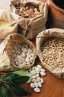 Sacks of dried beans and rice, top view — Stock Photo