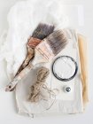 Still life of decorating brushes and string — Stock Photo