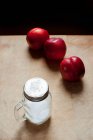 Peaches and jar of sugar — Stock Photo