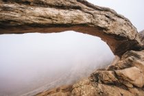 Arch rock formation in mist, Moab, Utah, USA — Stock Photo