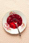 Plate of jam with spoon, top view — Stock Photo