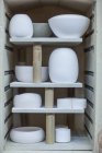 Cape Town, South Africa, bowls lined up in cupboard in ceramic workshop — Stock Photo