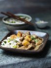 Dish of beef massaman curry with asparagus rice — Stock Photo