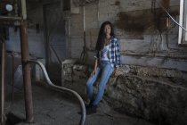 Portrait of pretty female teen in old barn — Stock Photo