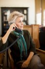 Senior woman on landline phone — Stock Photo