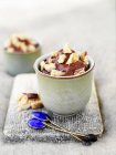Cup of chocolate pudding with topping — Stock Photo