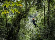Woman on zip wire in forest, Ban Nongluang, Champassak province, Paksong, Laos — Stock Photo