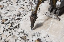 Pneumatic drill breaking concrete — Stock Photo