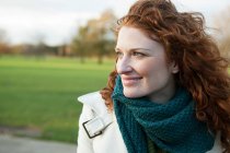 Portrait of a smiling red haired woman — Stock Photo