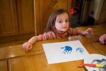Young girl finger painting — Stock Photo