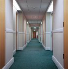 Front view of illuminated hotel corridor — Stock Photo