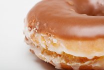 Close up shot of chocolate glazed doughnut — Stock Photo