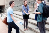 Students talking on campus steps, selective focus — Stock Photo